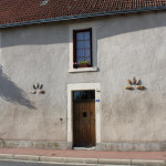 Hausfassade mit eingemauerten Livres de Beurre